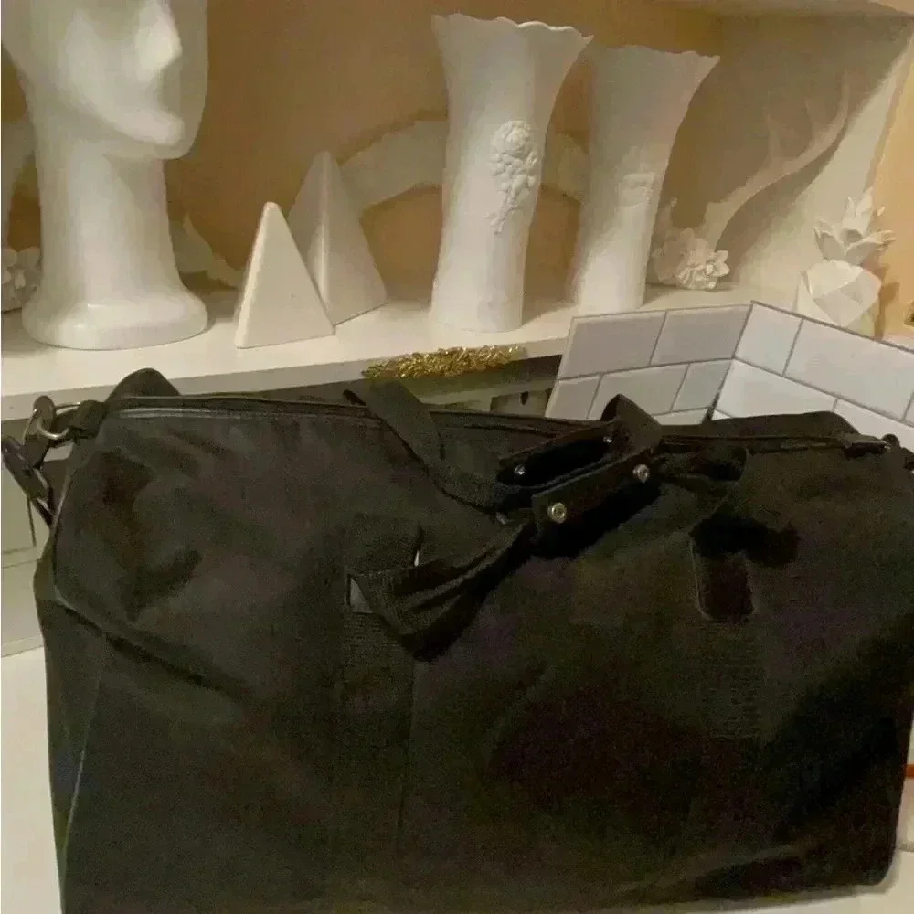 Escoda large travel bag waterproof, long adjustable straps fit a lot of stuff